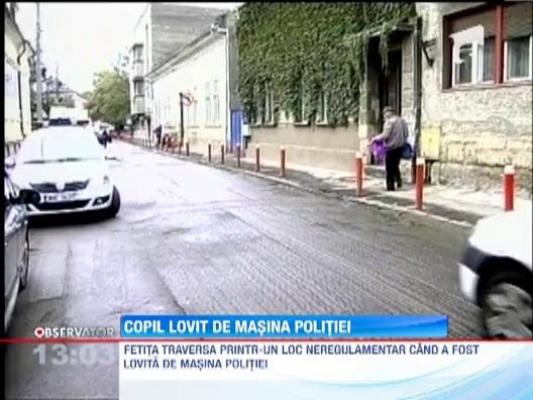 Copil lovit de masina politiei