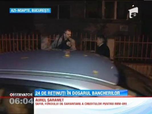 24 de oameni au fost retinuti in dosarul bancherilor