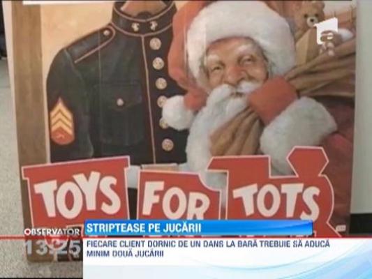 Un club de striptease din SUA ofera un dans la bara pentru orice client care vine si doneaza jucarii pentru copii