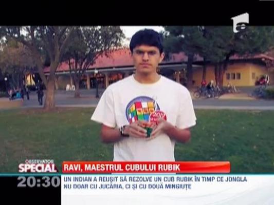 Ravi Jongleurul, maestrul cubului Rubik. L-a rezolvat in timp ce jongla, atat cu respectiva jucarie, cat si cu doua mingiute