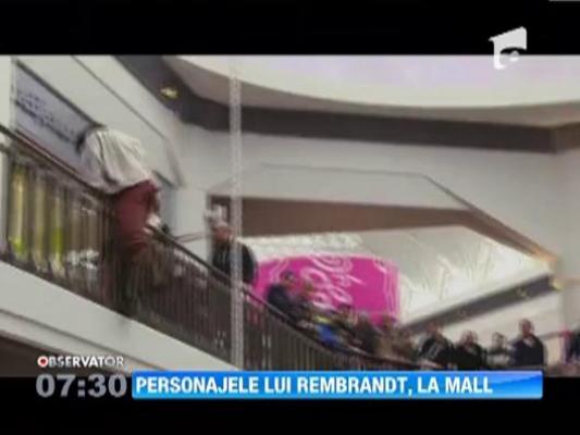 Personajele din celebra pictura "Rondul de noapte" a lui Rembrandt au iesit la mall