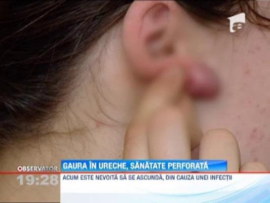O tanara a ajuns pe masa de operatie dupa ce si-a facut gauri in urechi