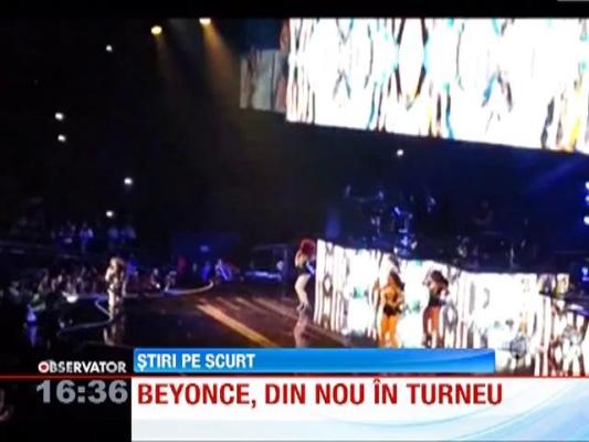 Beyonce aparut pe scena imbracata intr-o rochie stralucitoare cu sani falsi