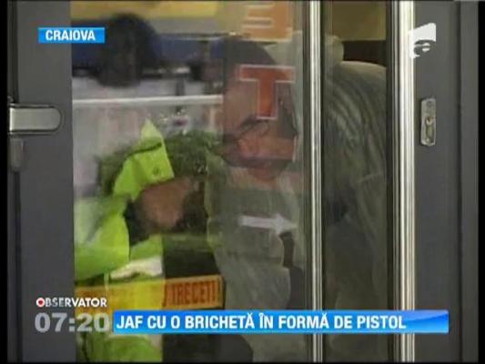 Jaf la un magazin de bijuterii cu o bricheta in forma de pistol