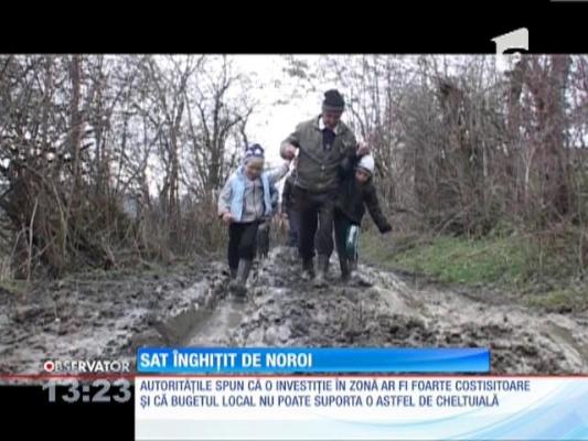 Sat înghiţit de noroi