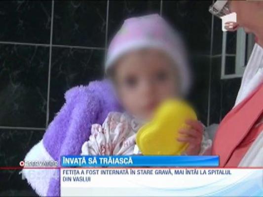 Fetiţa subnutrită din Vaslui face primii paşi spre recuperare