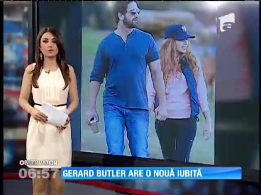 Gerard Butler, la braţul "sosiei" frumoasei Mădălina Ghenea