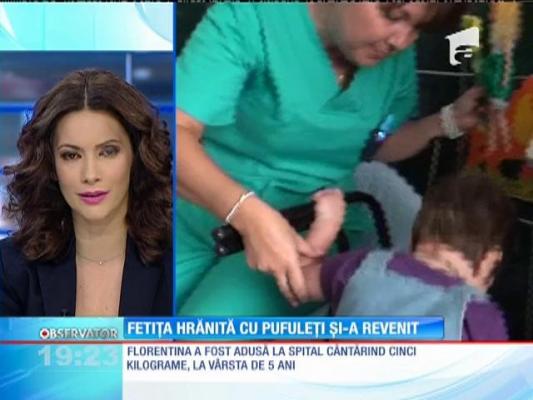 Fetiţa hrănită cu pufuleţi, şi-a revenit