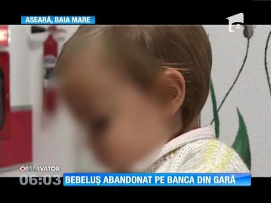 O fetiţă de zece luni, găsită pe o bancă, în gara din Baia Mare