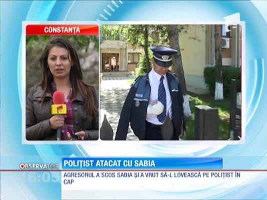 Poliţist atacat cu o sabie