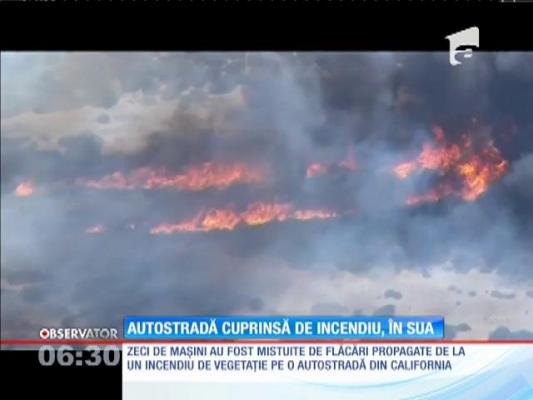 Zeci de maşini, mistuite de flăcări în urma unui incendiu de vegetaţie de lângă o autostradă din California