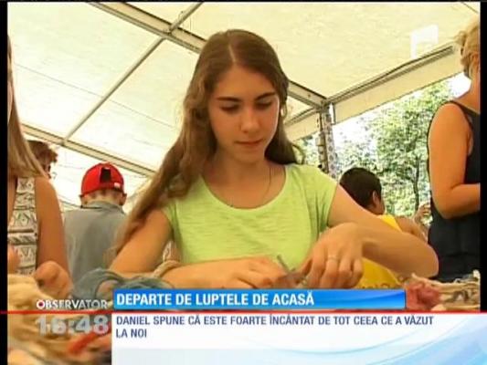 23 de copii care şi-au pierdut părinții în conflictele din Ucraina, ajutați de români