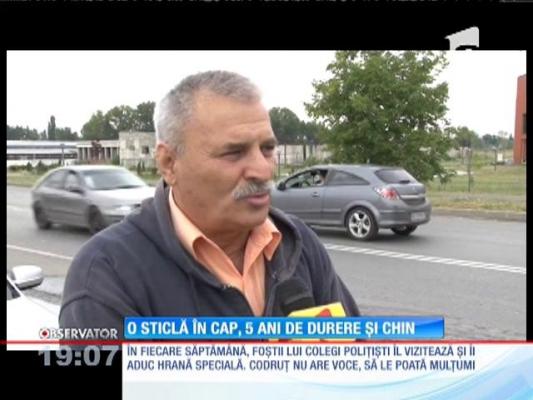 Un polițist atacat de un interlop trăiește la limita morții