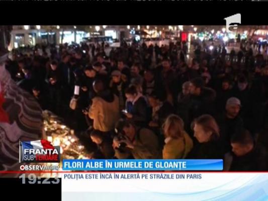 TEROARE LA PARIS | Urmele masacrului de pe străzi, acoperite cu flori albe