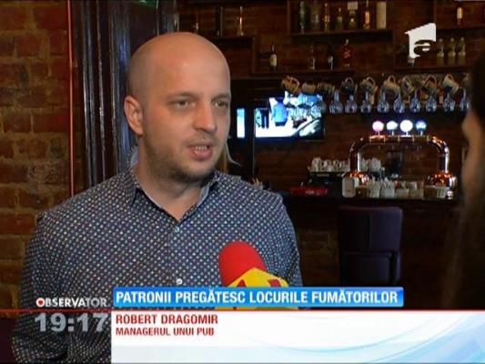 Patronii de baruri şi restaurante pregătesc locurile speciale pentru fumători
