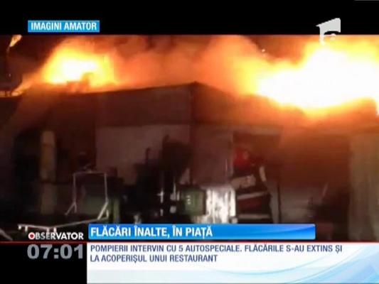 Un depozit de legume-fructe şi un restaurant din Piaţa Moghioroş, mistuite de flăcări