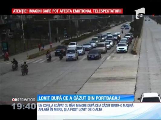 Copil lovit de altă mașină după ce a căzut din portbagaj