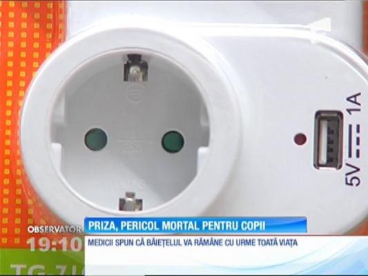 Priza, pericol mortal pentru copii!