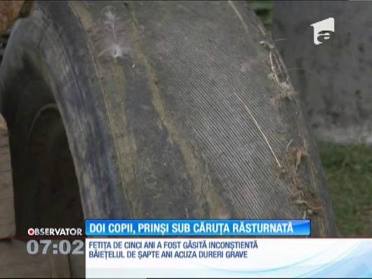 Doi copii au fost prinşi sub o căruţă încărcată cu prune, pe un drum forestier din judeţul Prahova