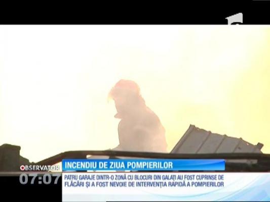 Incendiu de ziua lor! Pompierii din Galaţi s-au luptat cu flăcările care au cuprins patru garaje din apropierea unor blocuri