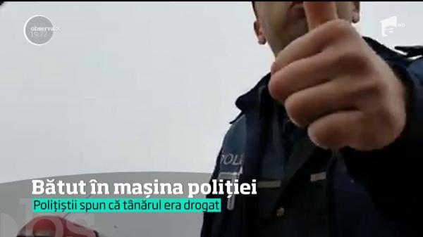 Şcene şocante au fost surprinse la Bârlad! Un om al străzii, bătut într-o maşină de Poliţie