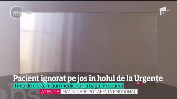 Imagini revoltătoare, la Craiova. Pacient întins pe jos, cu perfuzia în mână, IGNORAT de medicii de la Urgenţe