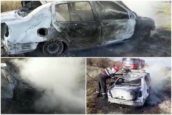 Mașină abandonată pe un câmp, făcută „scrum”. Autoturismul ar fi fost incendiat