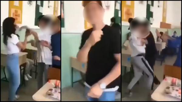 Doi elevi din Tecuci, fată și băiat, și-au împărțit pumni și picioare în sala de clasă. Amuzat, un adolescent și-a făcut cruce