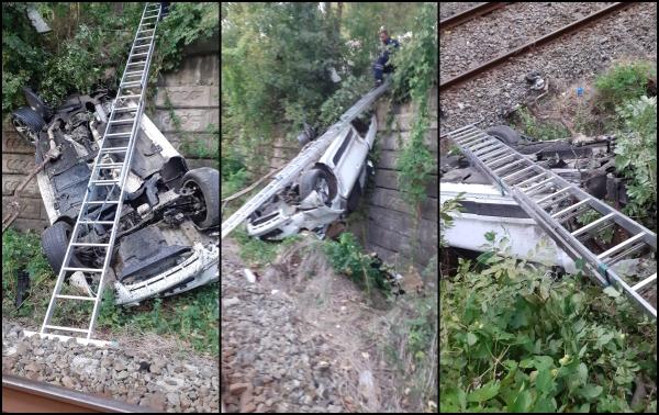 La un pas de tragedie: Autoturism căzut pe calea ferată în Vâlcea. Trei persoane au fost transportate la spital