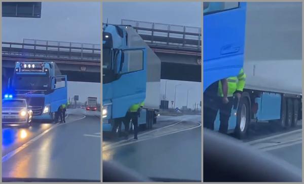 "I-o pus pistolul, băi, eşti prost?" Un poliţist, filmat în timp ce ameninţă un şofer de TIR, pe drumul dintre Arad şi Pecica - VIDEO