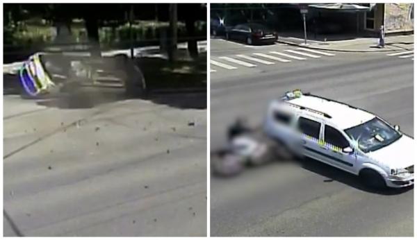 Momentul în care un motociclist din Timişoara este târât câţiva metri, după ce s-a lovit de un taxi. Maşina s-a răsturnat la marginea drumului