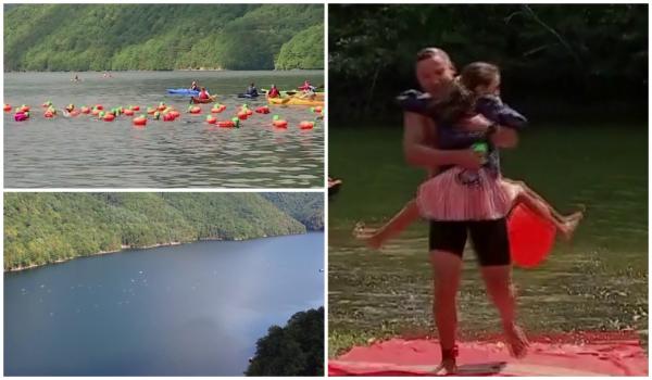 Lacul Tarniţa, traversat înot de zeci de români de toate vârstele. Nu i-a speriat nici vremea, nici limita de timp de doar 3 ore