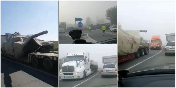 Convoi cu tancuri pentru Ucraina, împotmolit pe un drum din Sălaj. Unul dintre șoferi a ieșit cu un trailer în afara șoselei