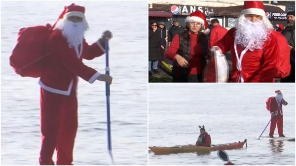 Moş Crăciun a venit cu placa de surf la Galaţi. Spiriduşii săi au vâslit din caiace pentru a oferi cadouri copiiilor din oraş