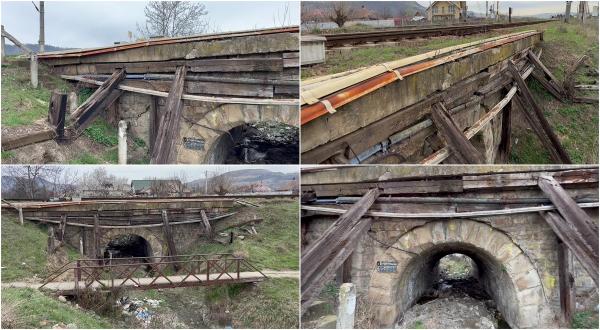 "Ne rugăm la Doamne-Doamne". Un pod din Bacău pe care trec zeci de trenuri se sprijină în bârne de lemn putrezite. Localnicii se plâng de 2 ani la CFR