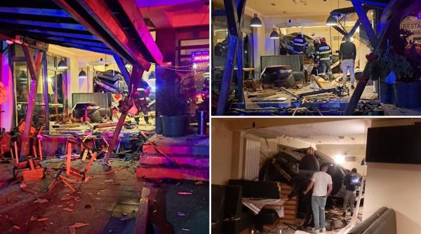 Filmul accidentului bizar din Cluj: un tânăr a intrat cu mașina într-un restaurant și a spulberat totul în cale. Angajații au crezut că e cutremur