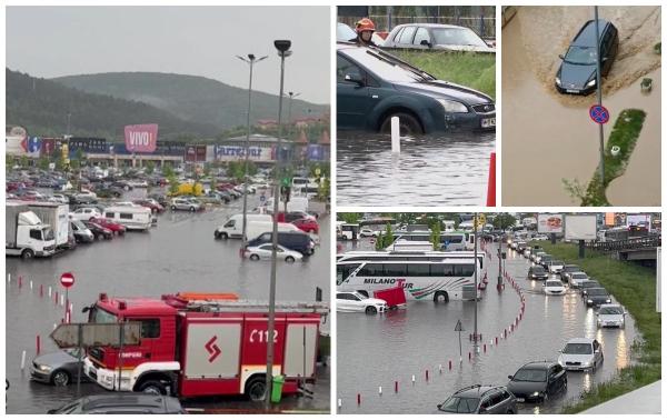 "A fost rupere de nori". O ploaie torențială a făcut prăpăd în Cluj. Parcarea unui mall a devenit bazin de înot