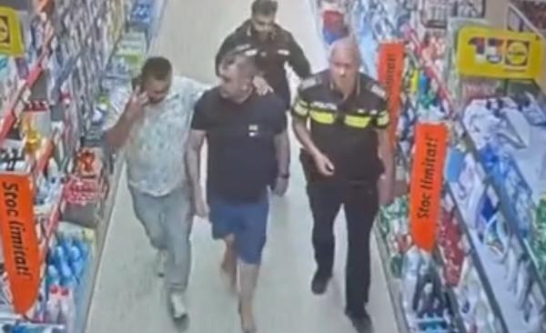 Momentul în care Radu Bucurică, procurorul pistolar, e ridicat din supermarket-ul din Snagov