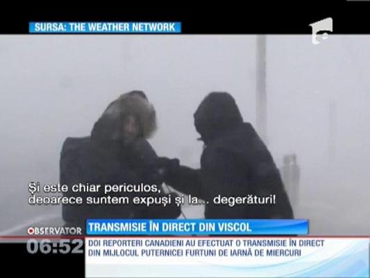 Reporteri luaţi de vânt în timpul unei transmisiuni în direct