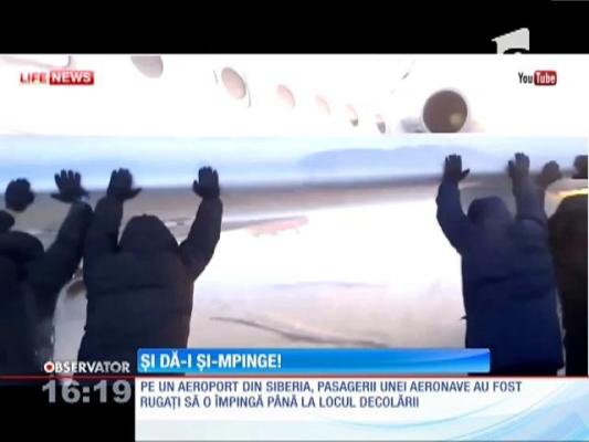 În Siberia, pasagerii împing avionul ca să decoleze