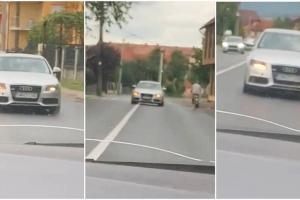 Șoferul unui Audi stârnește uluire pe un drum din Negrești Oaș, în Satu Mare: "Ăsta o fumat ceva cred...uite, și cu poliția acolo! E de necrezut"