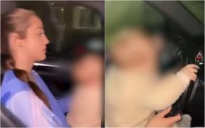 Şoferiţă de 25 de ani, filmată în timp ce îşi "învaţă" bebeluşul de 9 luni să conducă. Gestul inconştient, filmat şi postat online