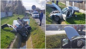 BMW rupt în două pe un drum din Gorj, jumătate din maşină a fost aruncată pe partea opusă a şoselei