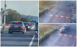 Momentul în care un șofer din Maramureş forţează bariera pe centura Băii Mari, cu puţin timp înainte de trecerea unui tren