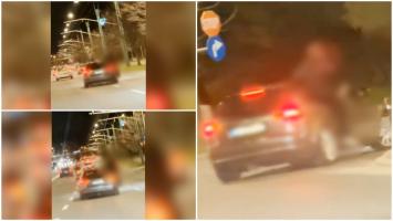 Un bărbat a fost amendat, după ce s-a plimbat prin Braşov agăţat de portiera unei maşini. Momentul, surprins de un şofer din trafic